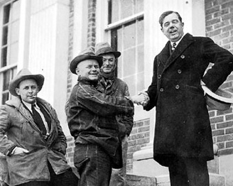 Huey Long shakes hands with rural farmers