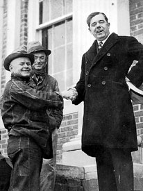 Huey Long shakes hands with constituents on the courthouse steps