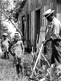 Box factory worker living in poverty as a result of low wages (1938).  The average wage was about one dollar a day for the average Louisiana factory worker.