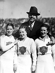 Huey Long with cheerleaders at a Louisiana State University football game.